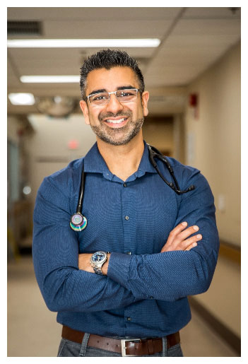 Dr. Vikram Ralhan in a blue shirt with stethoscope around his neck